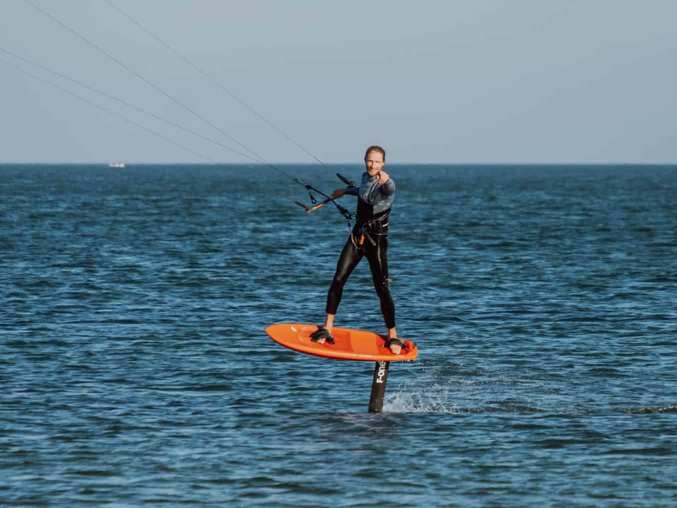 Kite foiling hydrofoil above water Lagos Portugal