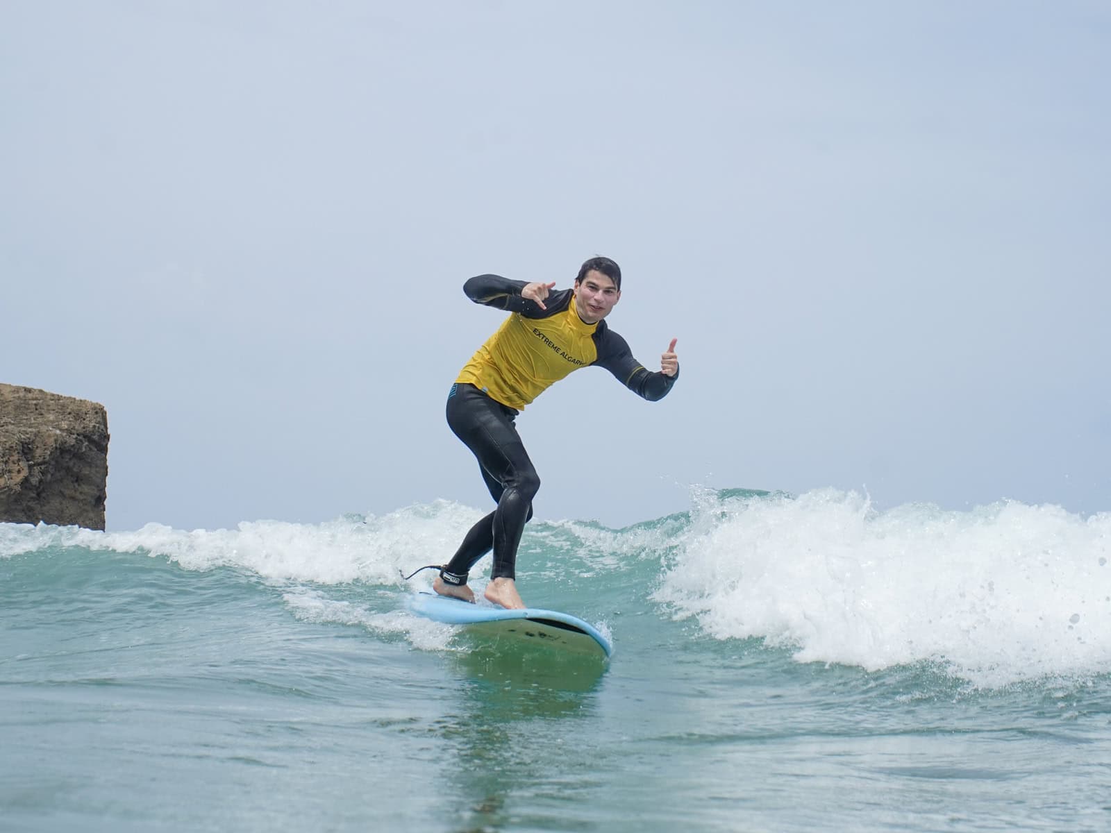 Happy surf camp guests progressing on the waves