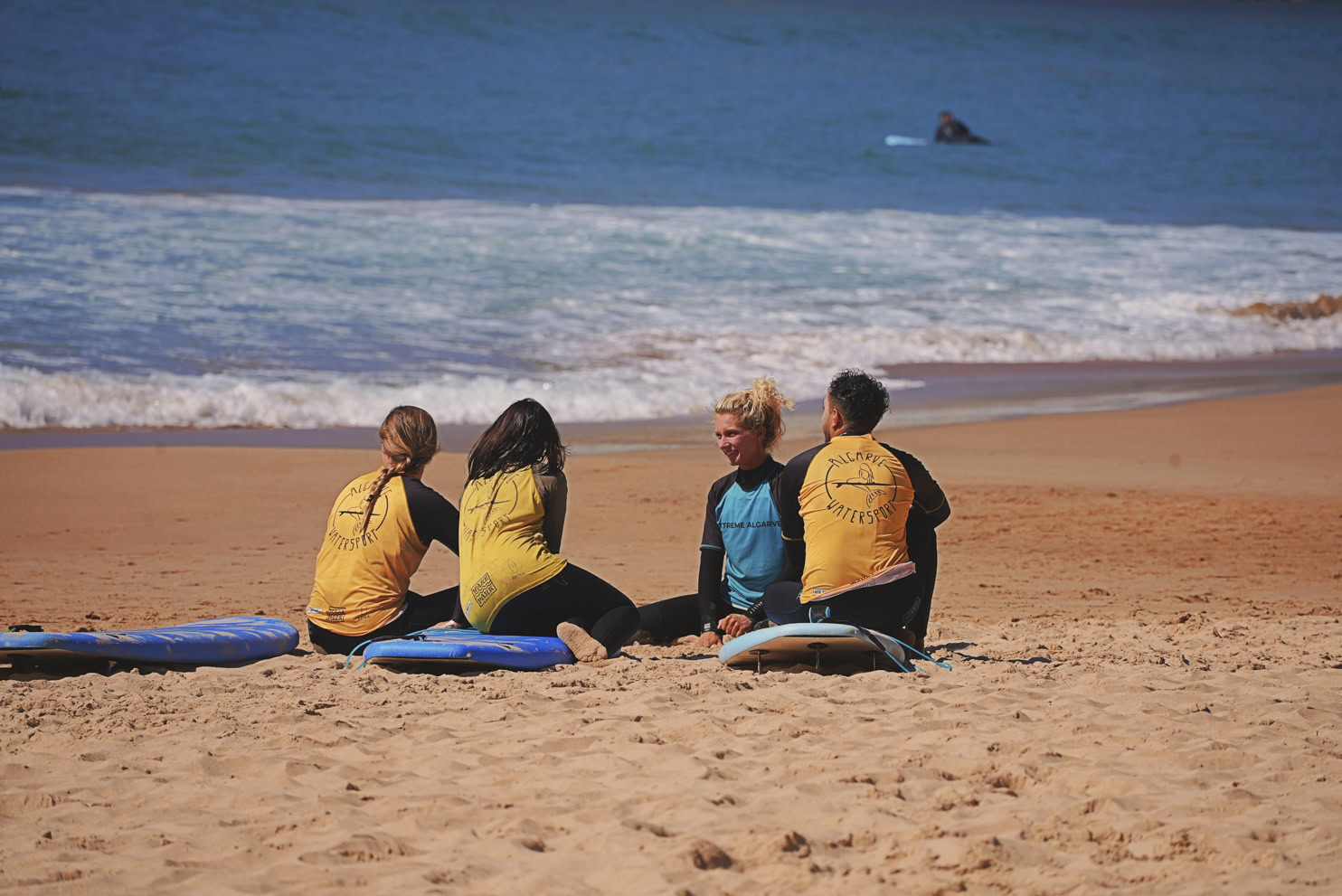 Small-group surf lesson (max 6) with certified coach at Meia Praia, Lagos