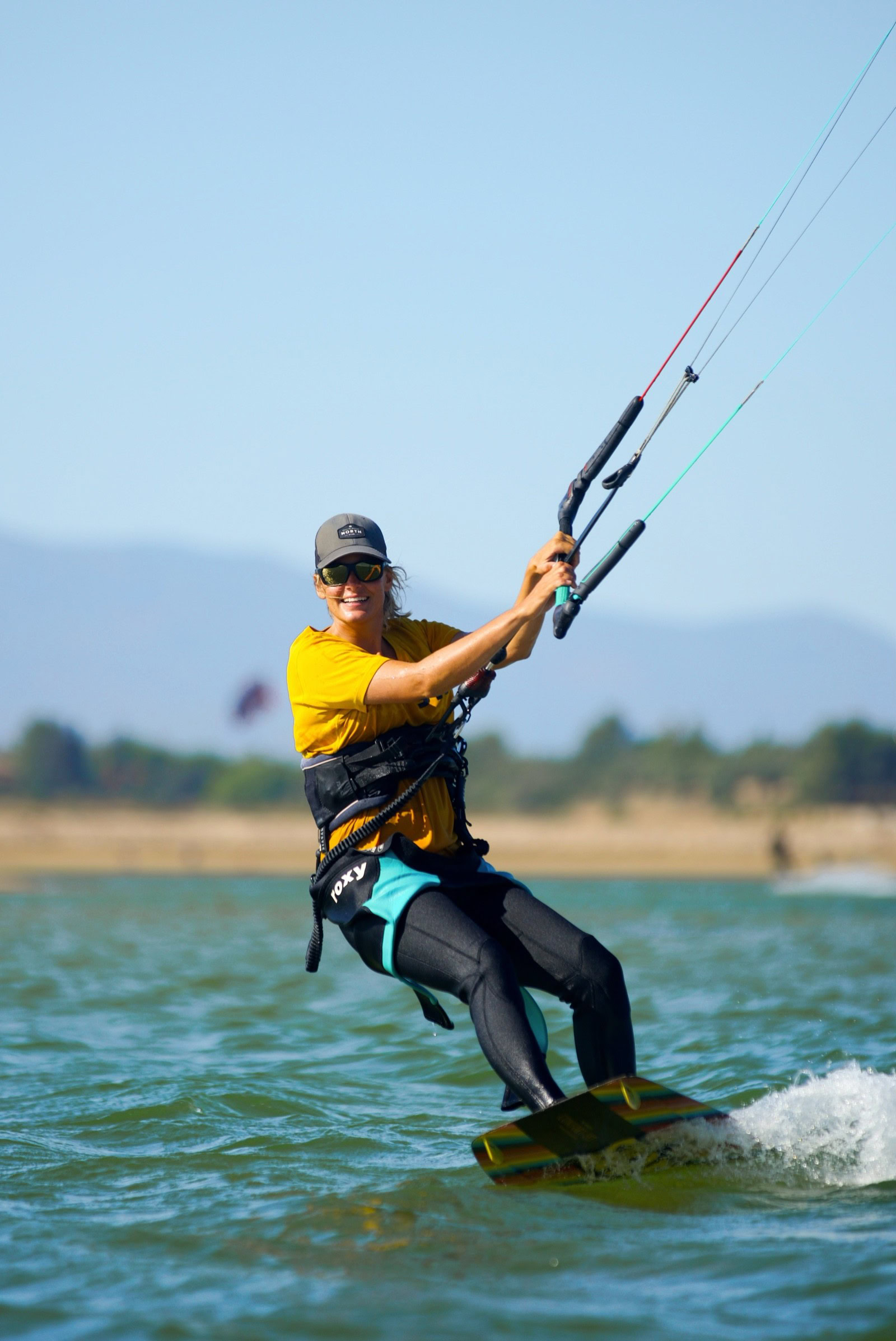 Kitesurf instructor riding close up action shot at Algarve lagoon