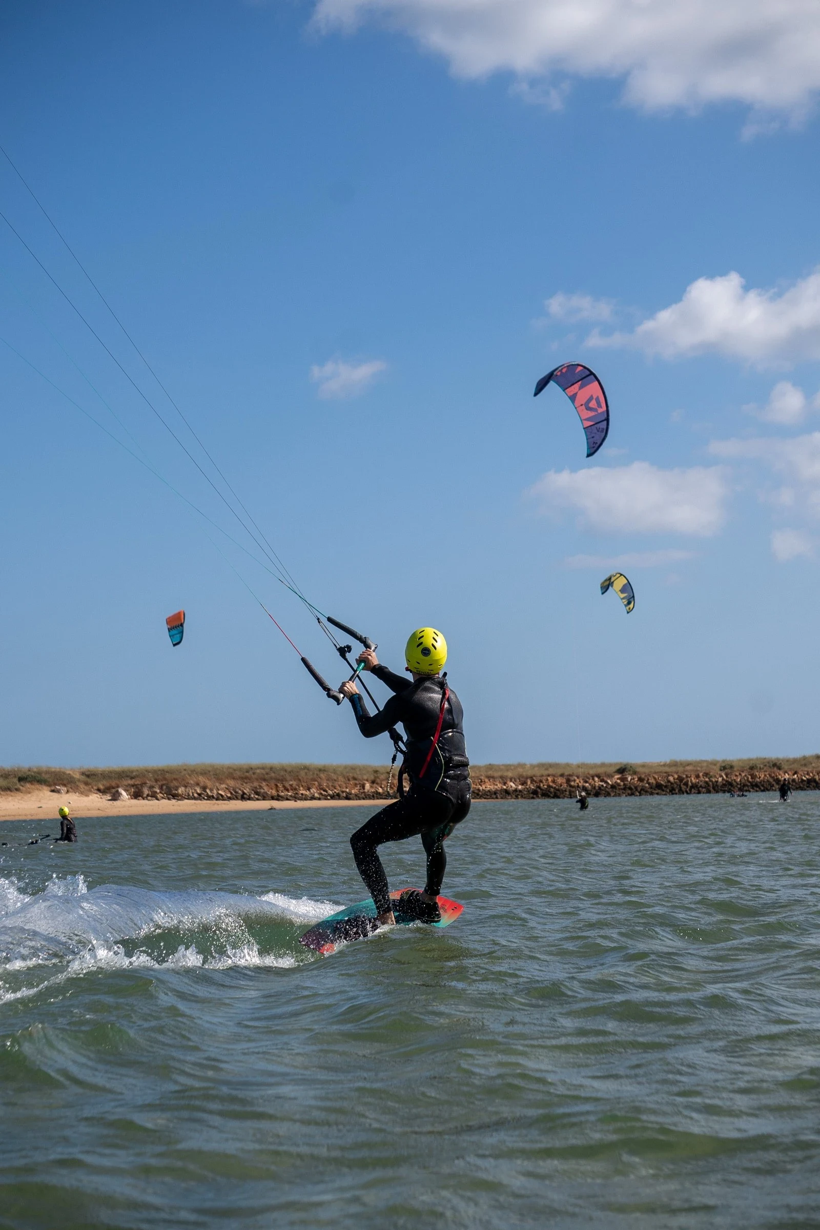 Kitesurf student riding during lesson at Algarve lagoon