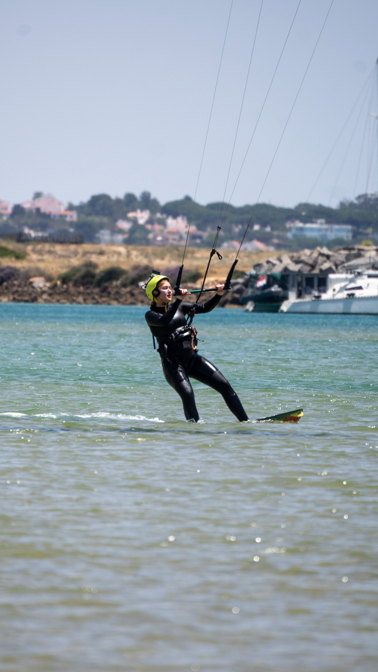 Kitesurf student riding independently Lagos harbour view licensed rider