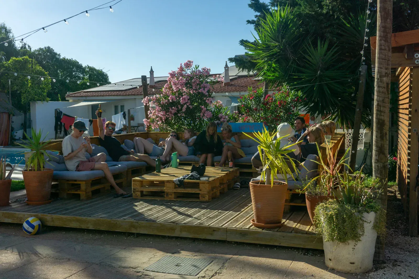 Guests relaxing with evening drinks at camp