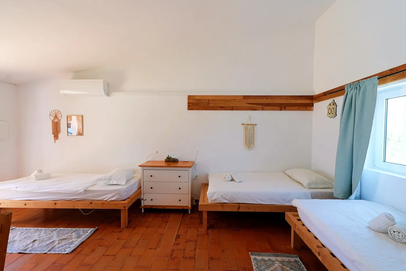 Bungalow bedroom with three beds at Algarve Watersport