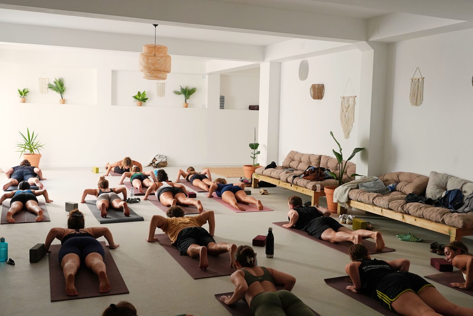 Group plank pose in the yoga studio at The Hill, Lagos